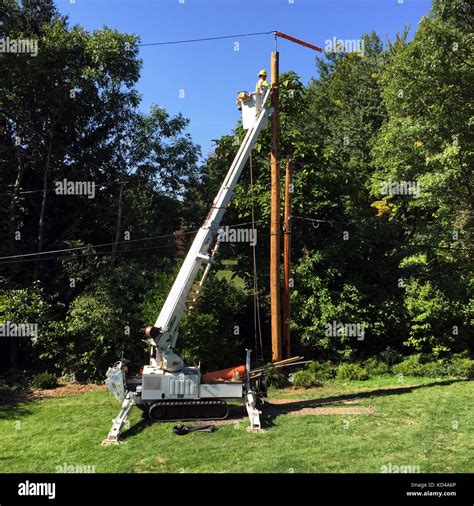 <b>Poles</b> are frequently installed on sloping ground or on the sides of ditches because a certain amount of clearance from roads and private property must be maintained. . Installing telephone pole